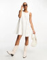 ASOS DESIGN textured godet chuck on playsuit in ivory