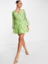 ASOS DESIGN button through ruched waist pleated mini dress in green floral print