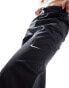 Nike mini swoosh high rise woven trousers in black