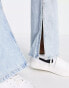 Only mid rise split hem flared jeans with distressing in light wash