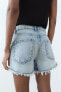 TRF CURVED HIGH-WAIST RIPPED DENIM SHORTS