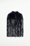 Short leather cape with fringing