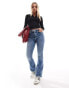 Фото #2 товара Miss Selfridge Petite heart pocket flare jean in mid wash