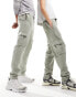 Фото #1 товара ASOS DESIGN unisex tapered joggers with cargo pockets in washed green