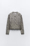 Cable-knit metallic sweater