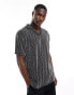 ASOS DESIGN relaxed revere polo in black textured stripe