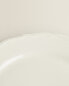 Earthenware dessert plate with raised-design edge