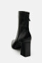 High-heel leather ankle boots with zip