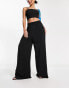 Urban Classics wide leg stretch trousers in black