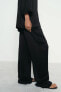 CREASED-EFFECT WIDE-LEG TROUSERS