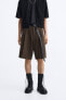 Wide-leg pleated bermuda shorts