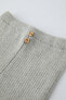 Ribbed sweater with buttons