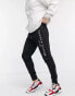 Фото #8 товара Tommy Hilfiger embroidered logo cuffed joggers in black