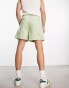 ASOS DESIGN wide cord shorts in shorter length in light green