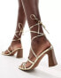 ASOS DESIGN Hideout strappy tie leg mid block heeled sandals in gold