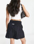 Фото #4 товара Nike Air woven mini skirt in black