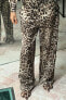 Straight fit snakeskin print trousers