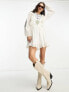 Фото #1 товара Reclaimed Vintage limited edition mini dress in white with cross stich embroidery