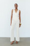 CREPE JUMPSUIT WITH ASYMMETRIC WAISTCOAT