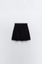 Box pleat knit mini skirt