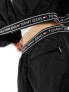 Tommy Jeans baggy taping trackpants in black