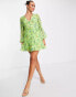 ASOS DESIGN button through ruched waist pleated mini dress in green floral print