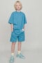 Plush t-shirt and bermuda shorts co-ord with label