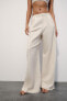 Flowing trousers with pleats