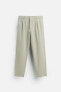 TEXTURED PLEATED TROUSERS