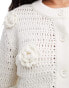 ASOS DESIGN knitted crew neck cardigan in open stitch with crochet flower detail in cream