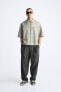 WIDE-FIT PLEATED TROUSERS