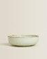 Porcelain bowl with antique finish rim