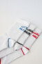 Pack of three pairs of sports socks with slogan