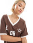 Lioness v neck sports jersey top in brown with white contrast trims