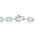 Фото #4 товара Blue Topaz (7-3/8 ct. t.w.) & Diamond (1/10 ct. t.w.) Link Bracelet in Sterling Silver