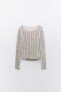 Asymmetric open-knit sweater