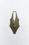 Halter swimsuit with metal piece