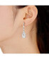 ფოტო #3 პროდუქტის Sterling Silver White gold Plated Pear Drop Cubic Zirconia with Halo Burst Earrings
