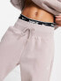 Nike Mini Swoosh oversized joggers in taupe