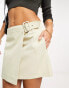 NA-KD x Durnels side buckle mini skirt in beige