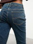 COLLUSION x007 stretch flare jeans in midwash blue