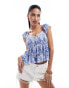 Фото #1 товара Hollister smocked flutter sleeve top in blue print