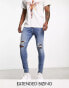 ASOS DESIGN spray on jeans with power stretch in mid wash blue