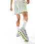 adidas Running Switch FWD 2 trainers in white and green