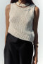 KNIT TOP WITH CHAIN DETAIL AND ASYMMETRIC HEM