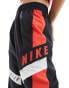 Nike Streetwear woven trackpant in black and red