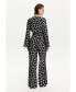 Фото #6 товара Women's Printed V-Neck Belted Jumpsuit