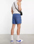 ASOS DESIGN pull on mid length denim shorts with cargo pockets in mid wash blue