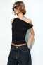 Gathered ribbed asymmetric top