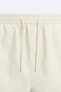 Embroidered faded bermuda shorts